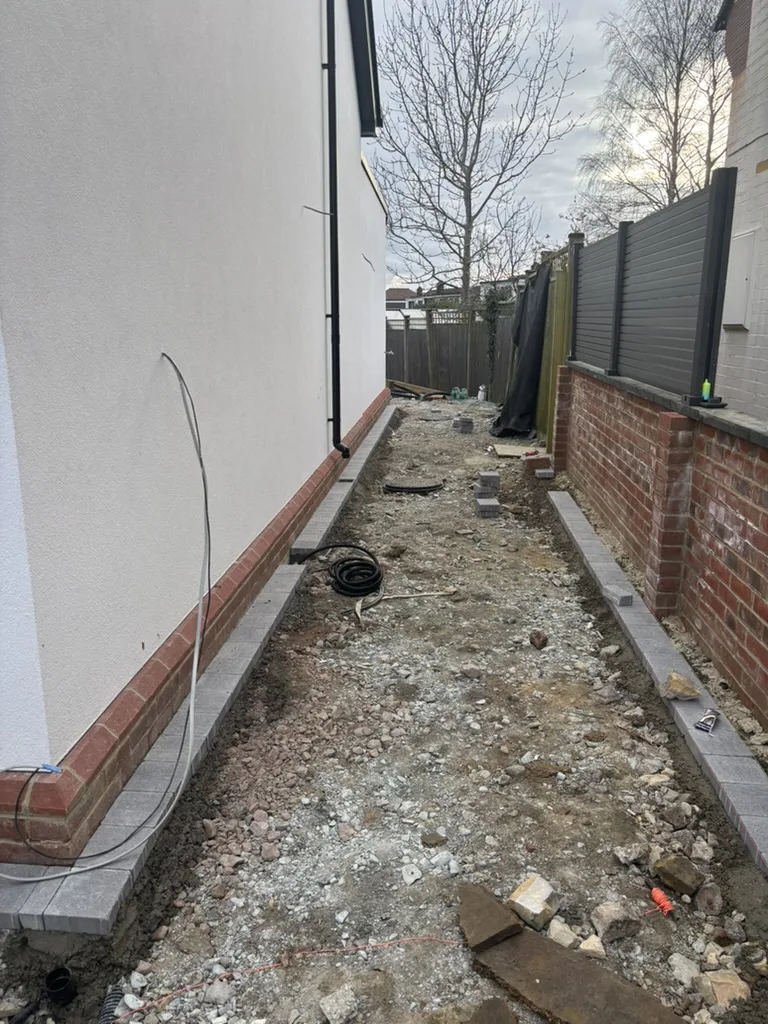 The test project&rsquo;s restricted side access during groundworks.